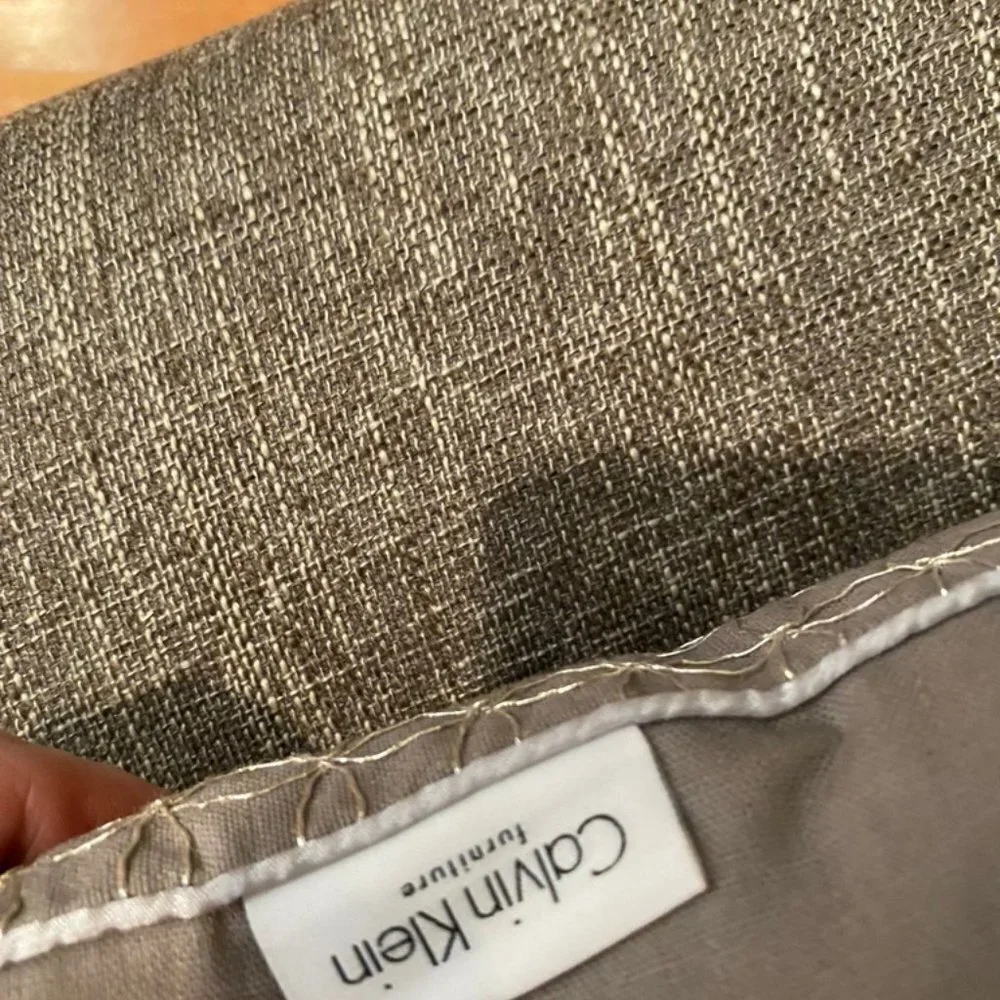 Calvin Klein silver embroidered grey pillow